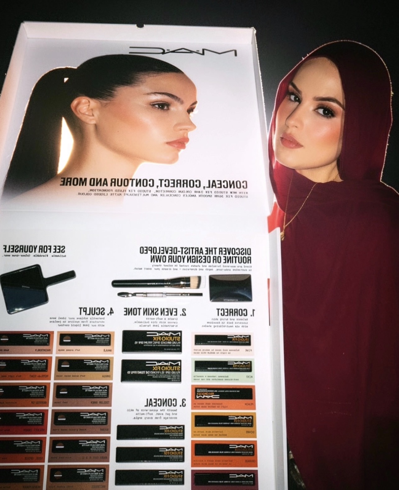 Sana Aijaz beside a professional makeup artistry display