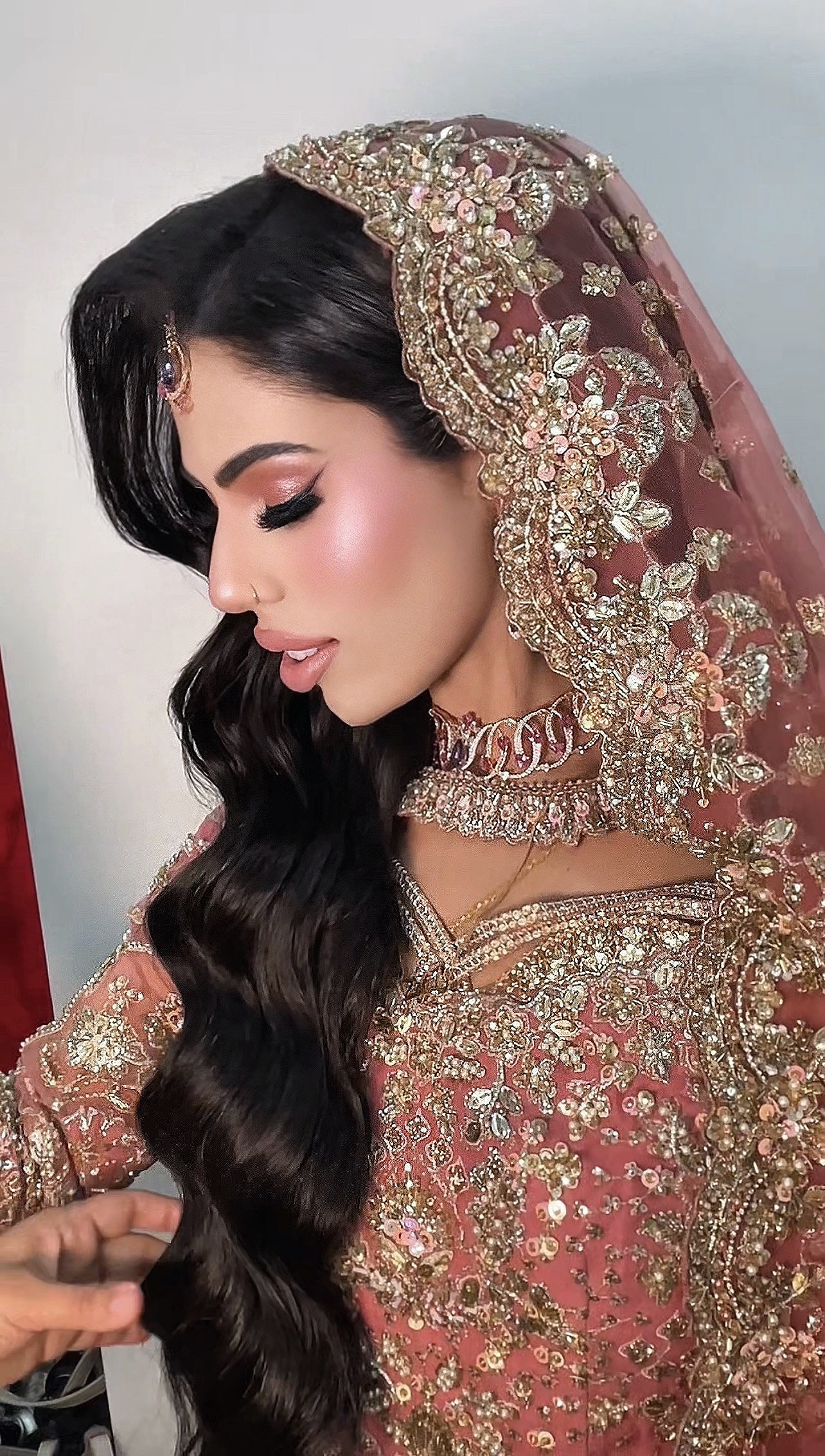 Close portrait of pink bridal makeup and hairstyling